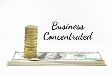 a tower of coins and banknotes below with the word business concentrated