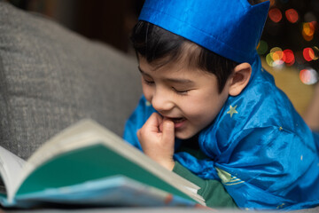 Happy child reading book