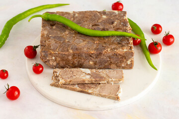 Turkish roasted meat ( kavurma ) on a white marble background.