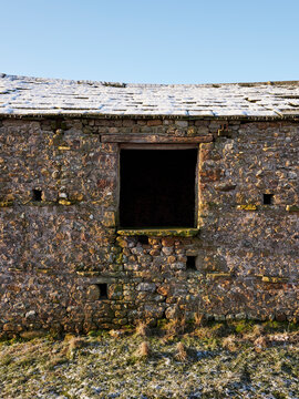 Old stone barn at sunrise on a frosty morning. Cumbria, UK.