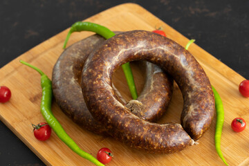 Turkish sausage kangal sausage on wooden floor. Local name dana sucuk.