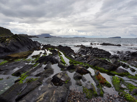 Rockpools and Jura from Seil. Scotland, UK.