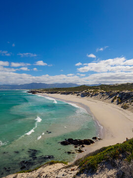Wonderful elevated views of the Walker Bay Nature Reserve coastline with the Kleinrivier mountains in the far distance. De Kelders near Gansbaai. Overberg. Western Cape. South Africa.