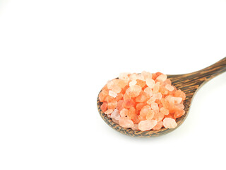 Fototapeta na wymiar Himalayan pink salt in wooden spoon isolated on a white background. Close up with copy space for your text. .