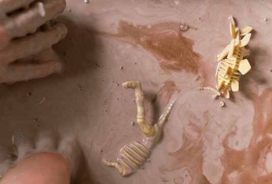 young girl gets very messy and muddy with oobleck mud in preschool d