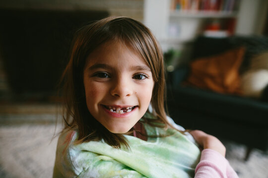 closeup of little kid with missing tooth