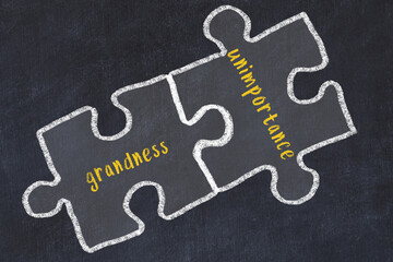 Chalk drawing of two puzzles with words grandness and unimportance - obrazy, fototapety, plakaty