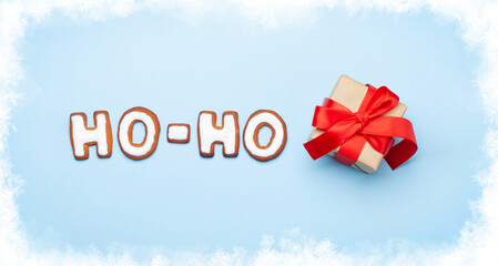 Christmas greeting card with gingerbread HO-HO text