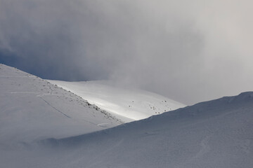 Lights and shadows on a snowy mountain