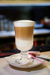 Glass of hot Latte coffee. Close-up, selective focus