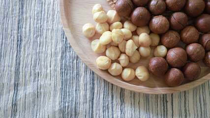 Organic Macadamia nut. macadamia nuts are cracked and baked to taste extremely delicious superfood fresh natural shelled unsalted raw macadamia and healthy food concept