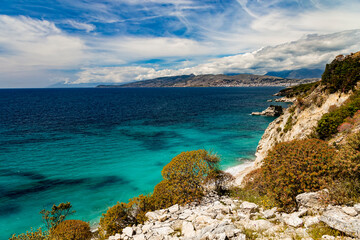 Albania, Saranda resort. View of the rocks, beach and the sea, Corfu island is on the horisont....