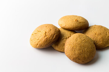 Gingerbread round cookies in a heap isolated on white background with copy space - gingersnap biscuits stack
