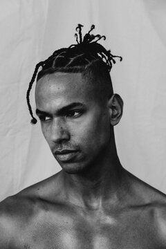 Sweaty Portrait Of A Man In Front Of White Sheet
