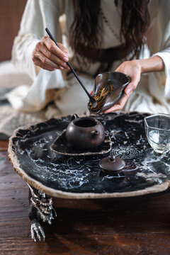Woman brews chinese tea