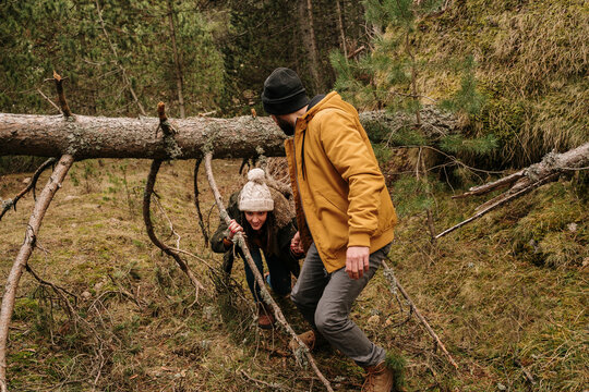 Couple with wolf dogs hiking in the mountain