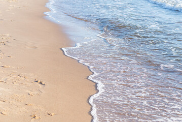 Soft wave of the sea on the sandy beach.Soft focus,blurred image.