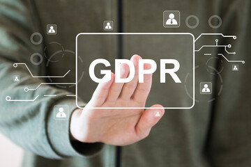 Businessman presses button general data protection regulation GDPR icon on virtual electronic interface.