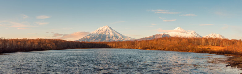 Autumn natural scenery, panoramic pictures of the famous Koryaksky and Avachinsky volcanoes in Kamchatka, Russia.