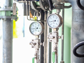Pressure gauge of measuring instrument close up in industry zone at power plant with closed up