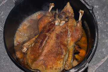 Crispy roasted stuffed duck in the dutch oven. 