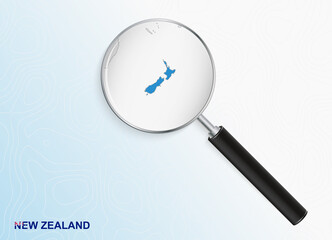 Magnifier with map of New Zealand on abstract topographic background.