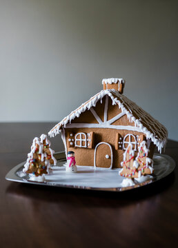 Homemade gingerbread house, decorated with icing for Christmas. 