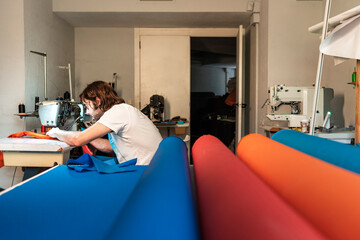 Modern entrepreneur using sewing machine