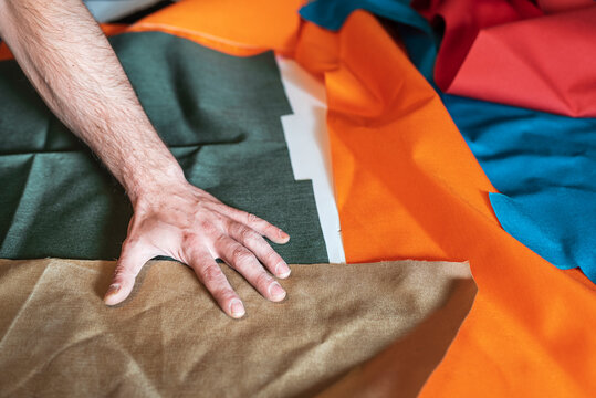 Textile designer using a bolt of fabric