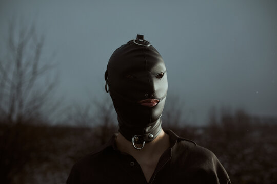 Male slave in public wearing a mask