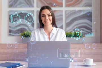 Attractive businesswoman in white shirt at workplace working with laptop to optimize development by...