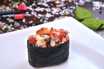 Spicy gunkan maki sushi with isolated on white background side view