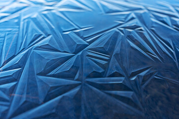 Blue ice shapes on a frozen pond