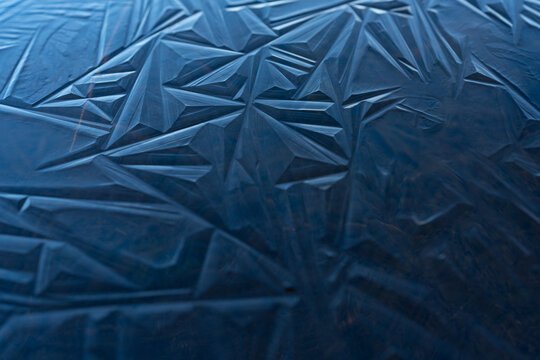 Blue ice shapes on a frozen pond