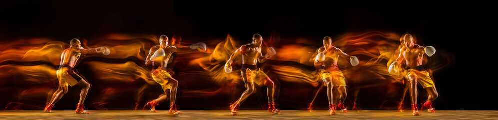 Fototapeta na wymiar Professional african-american boxer training on black studio background in mixed light. with strobe, reflection, mirror effect. Collage.