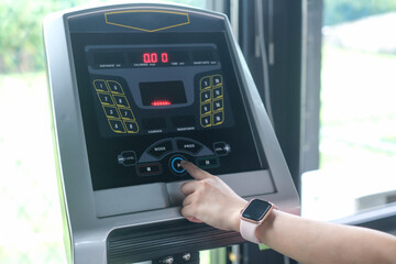 people running in machine treadmill at fitness gym.