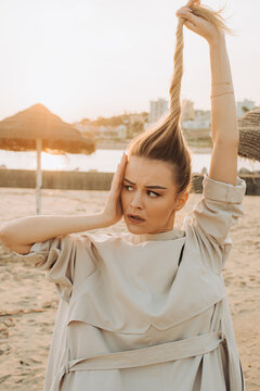 Woman messing around pulling up her hair 