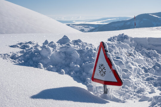 snow road sign with loads of snow everywhere