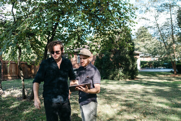 Film director and assistant collaborating in between scenes