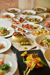 A set of delicious restaurant dishes Free space for your text. Different types of dishes on the table. Concept for restaurant menu.