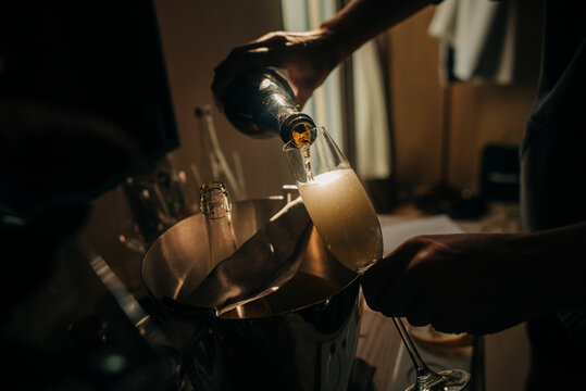 Man pouring wine in a glass
