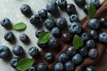 Fresh berry concept with blueberry on gray textured table
