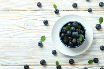 Naklejka na ściany i meble Fresh berry concept with blueberry on white wooden table