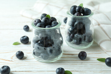 Fresh berry concept with blueberry on white wooden table