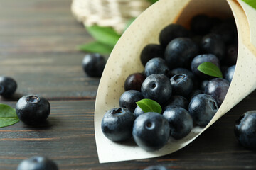 Fresh berry concept with blueberry on wooden table