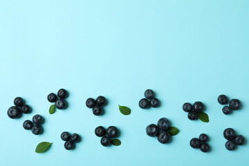 Fresh blueberry with leaves on blue background