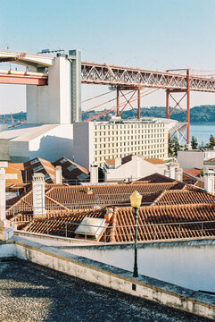 View of tiled roofs, buildings and a bridge