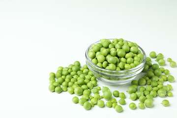Bowl with pea seeds on white background