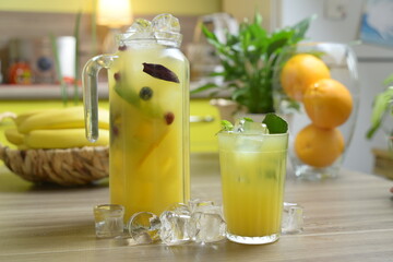 homemade cocktail on the wooden table closeup on kitchen blurred background