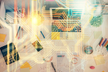 Double exposure of map hologram drawing over study table background with computer. Concept of international network. Top view.